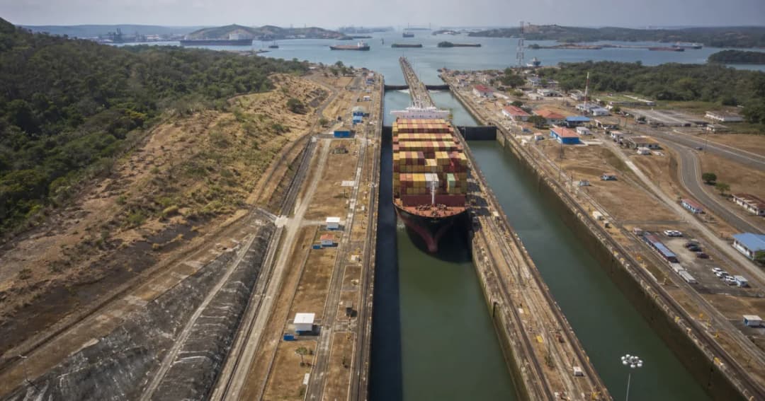 Container ship passing through Panama Canal locks during dry watershed conditions