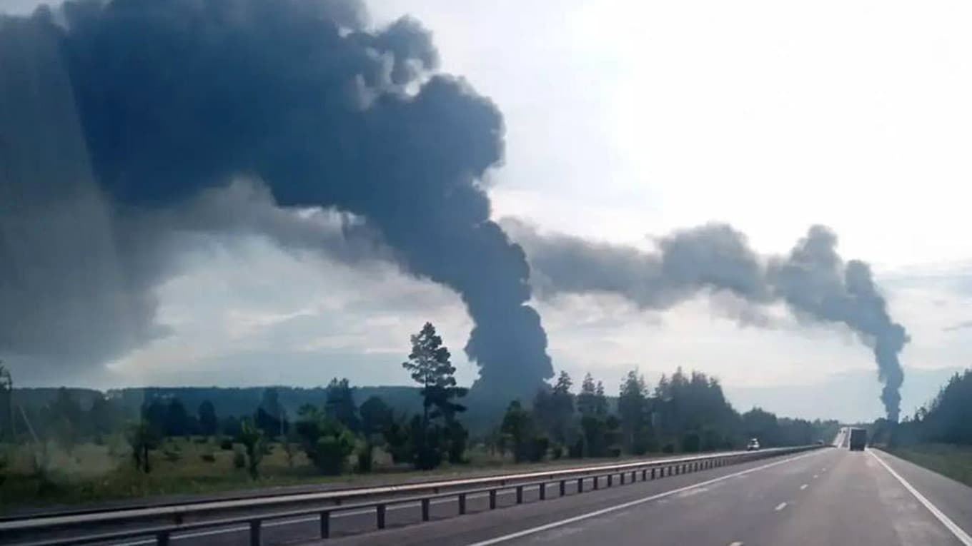 Smoke rising beyond a highway in an image reported to show Ulyanovsk following a drone attack on July 23, 2026